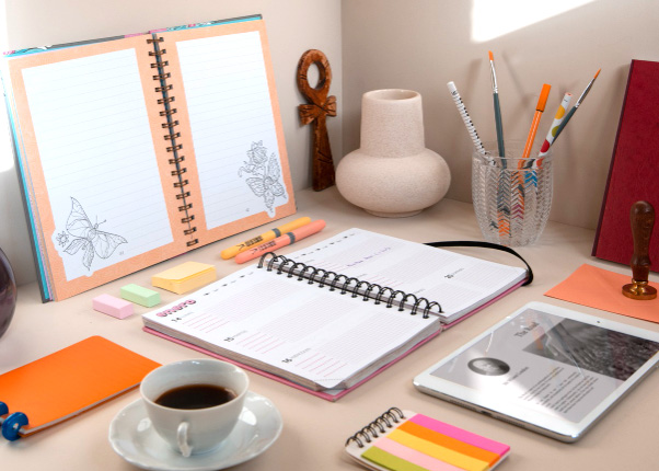 Organized desk with everything laid out perfectly with weekly planner opened to this week.