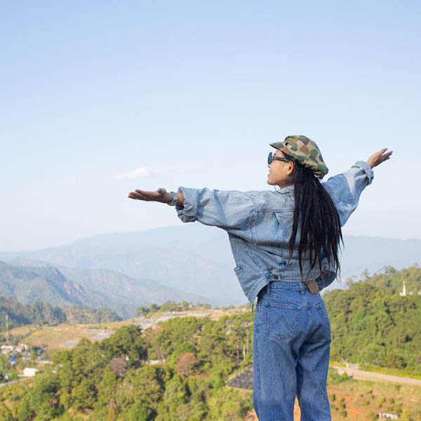 Joyful woman looking towards a beautiful view.