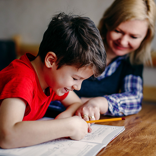 Mom helping son with learning disabilities.